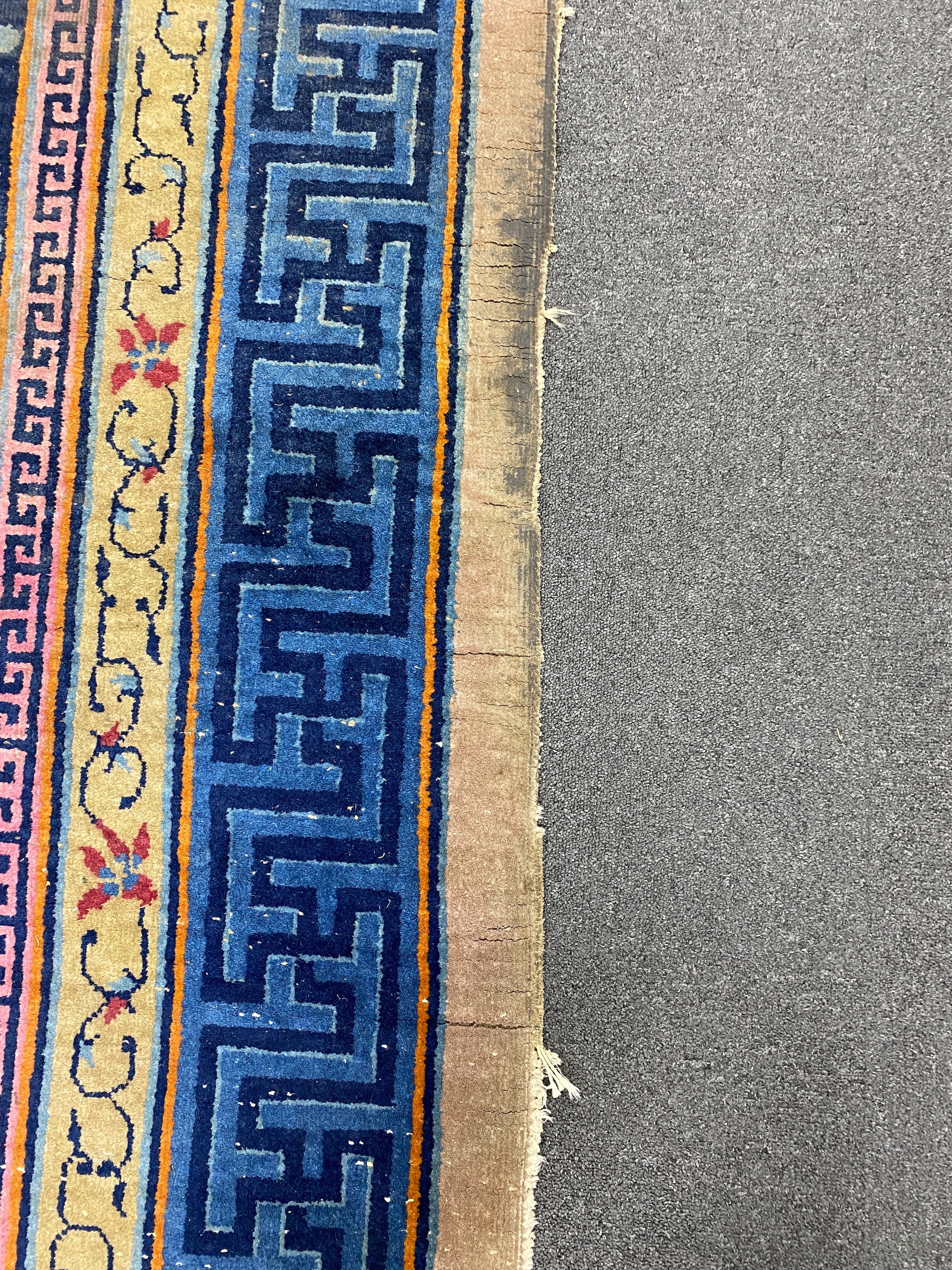 An early 20th century Chinese lilac ground carpet, 330 x 240cm